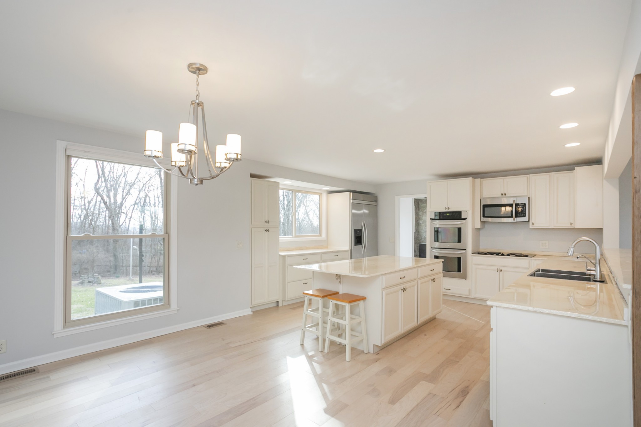 742 C Bates Road Lebanon, TN 37087 - Photo 22 of 59 a large white kitchen with sink and refrigerator