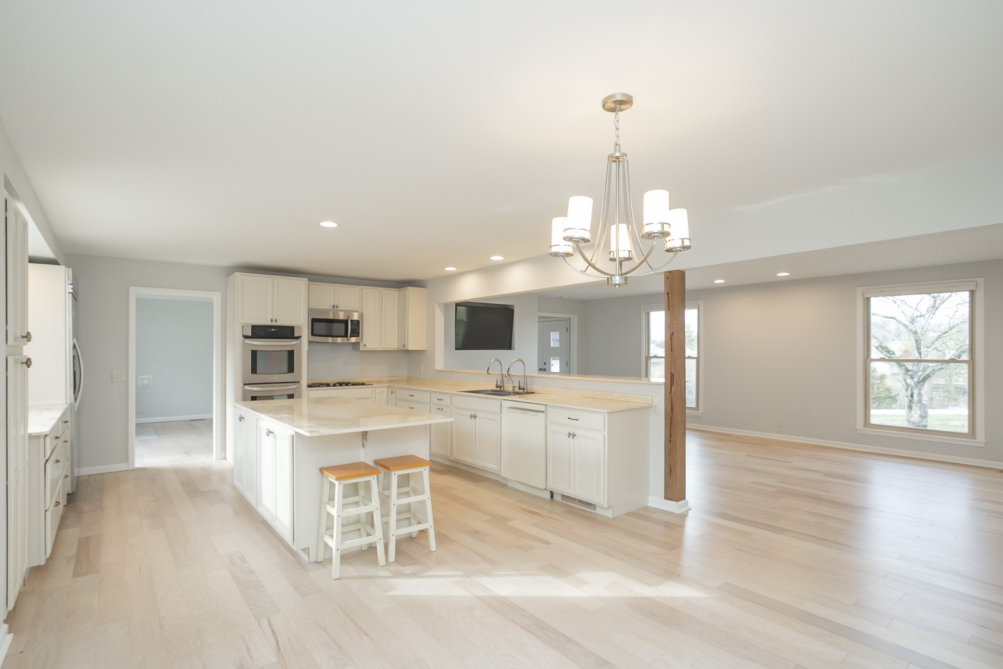 742 C Bates Road Lebanon, TN 37087 - Photo 23 of 59 a large kitchen with kitchen island white cabinets and stainless steel appliances