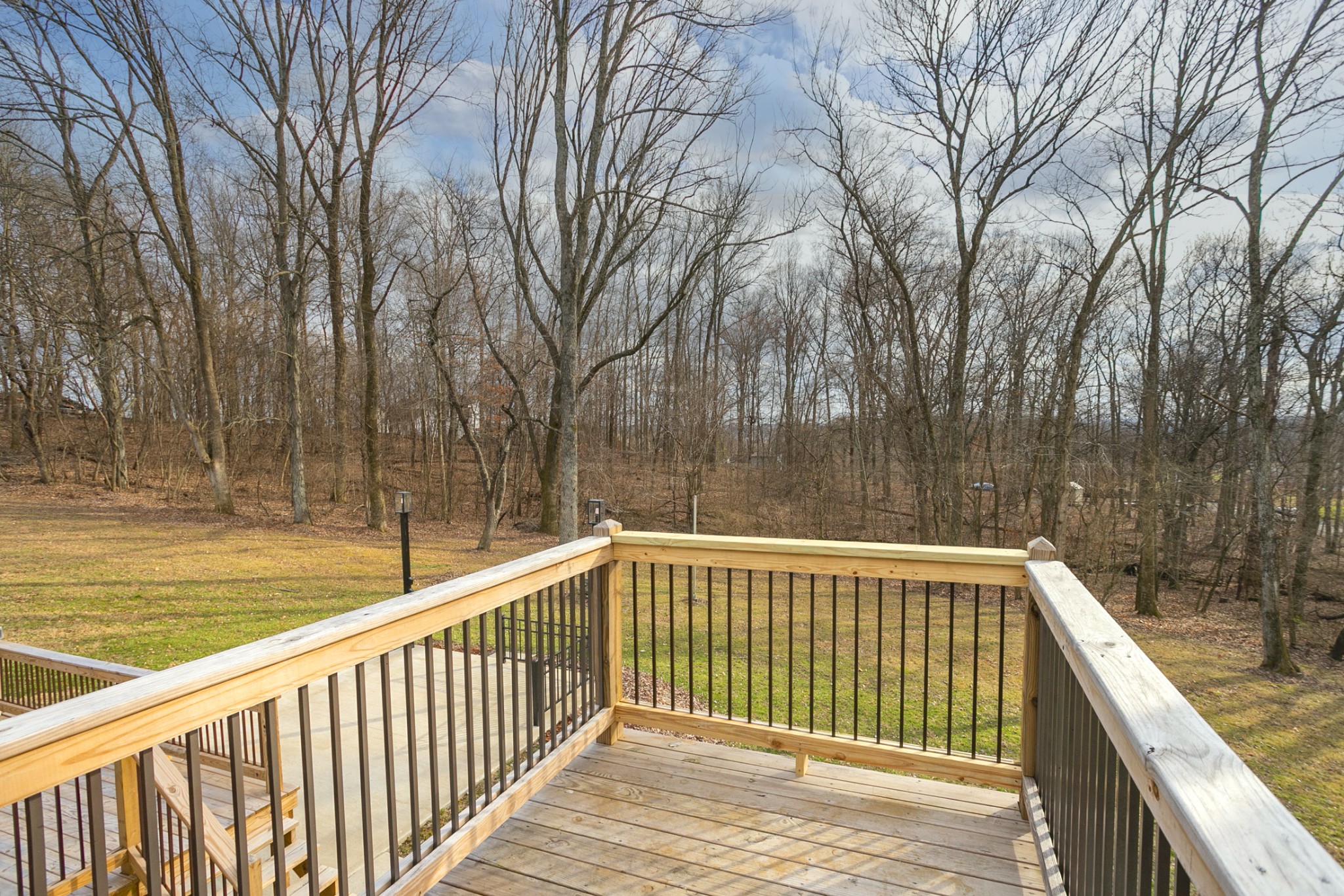 742 C Bates Road Lebanon, TN 37087 - Photo 33 of 59 a view of a wooden deck with large trees