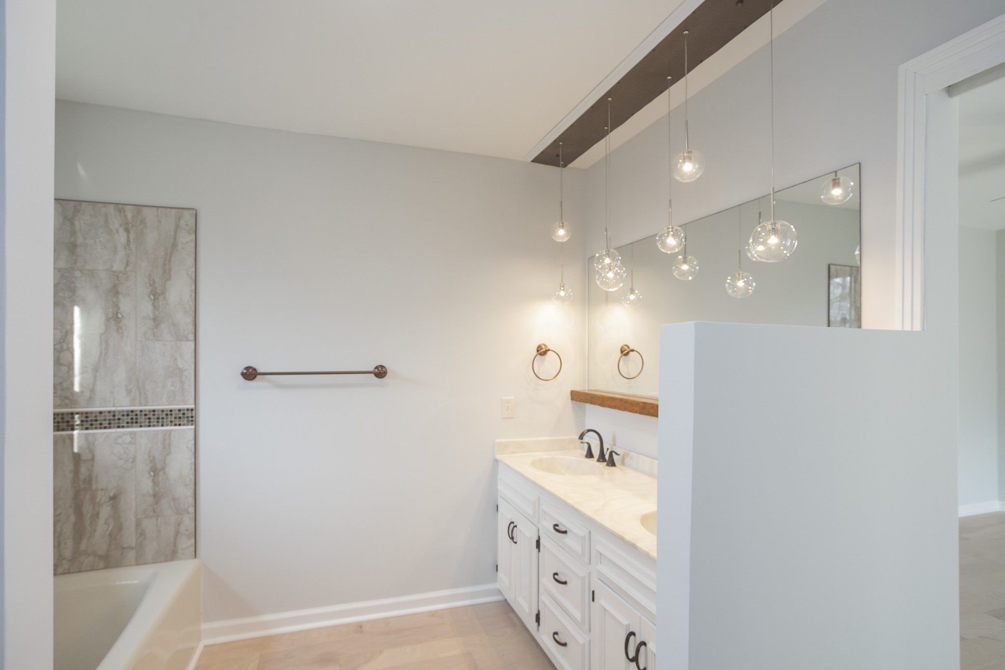 742 C Bates Road Lebanon, TN 37087 - Photo 35 of 59 a bathroom with a double vanity sink a toilet and shower