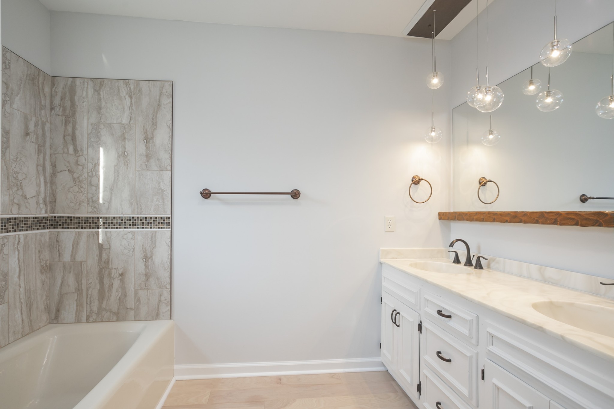 742 C Bates Road Lebanon, TN 37087 - Photo 36 of 59 a bathroom with a tub sink and mirror