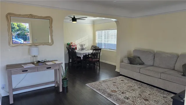 a living room with furniture and a table
