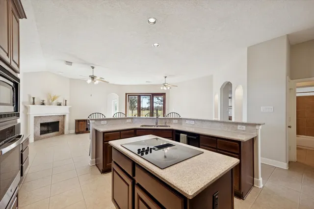 a kitchen that has a table and chairs in it