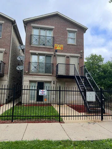 a view of a house with a yard and plants
