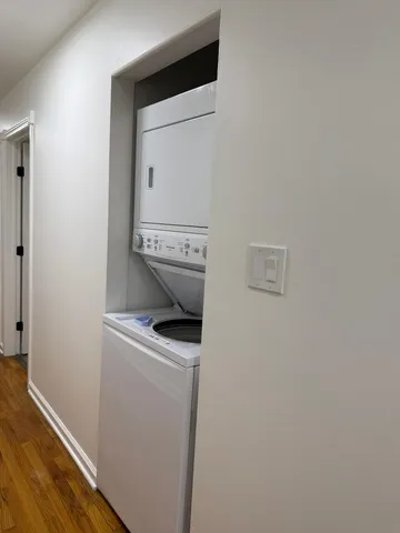 a view of storage and utility room with washer and dryer
