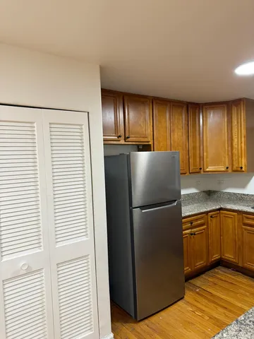 a kitchen with a refrigerator and a sink