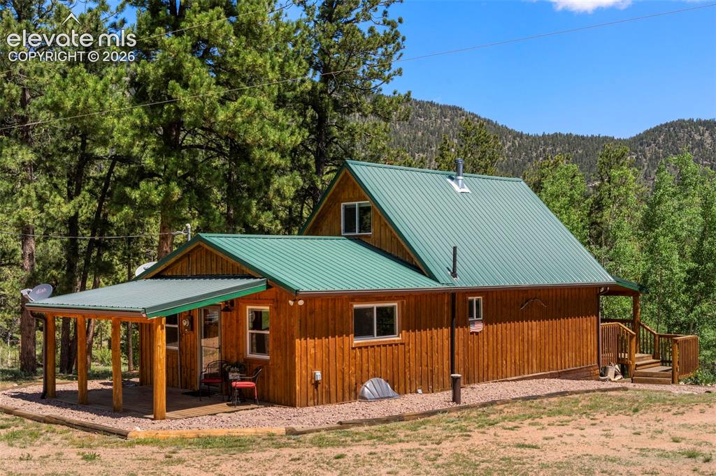 546 Pulver Road Lake George, CO 80827 - Photo 3 of 45 a house with trees in the background
