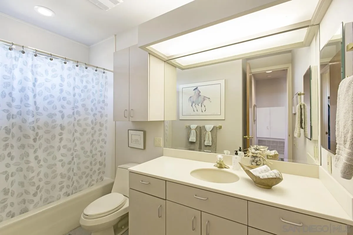 1629 Wild Acres Road Vista, CA 92084 - Photo 14 of 34 a bathroom with a sink toilet and shower