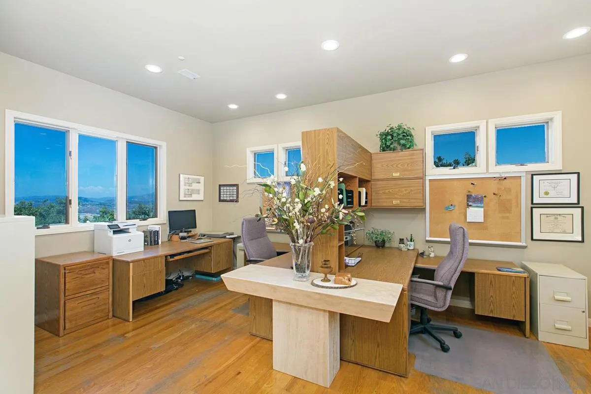 1629 Wild Acres Road Vista, CA 92084 - Photo 15 of 34 a view of a workspace with furniture and a large window