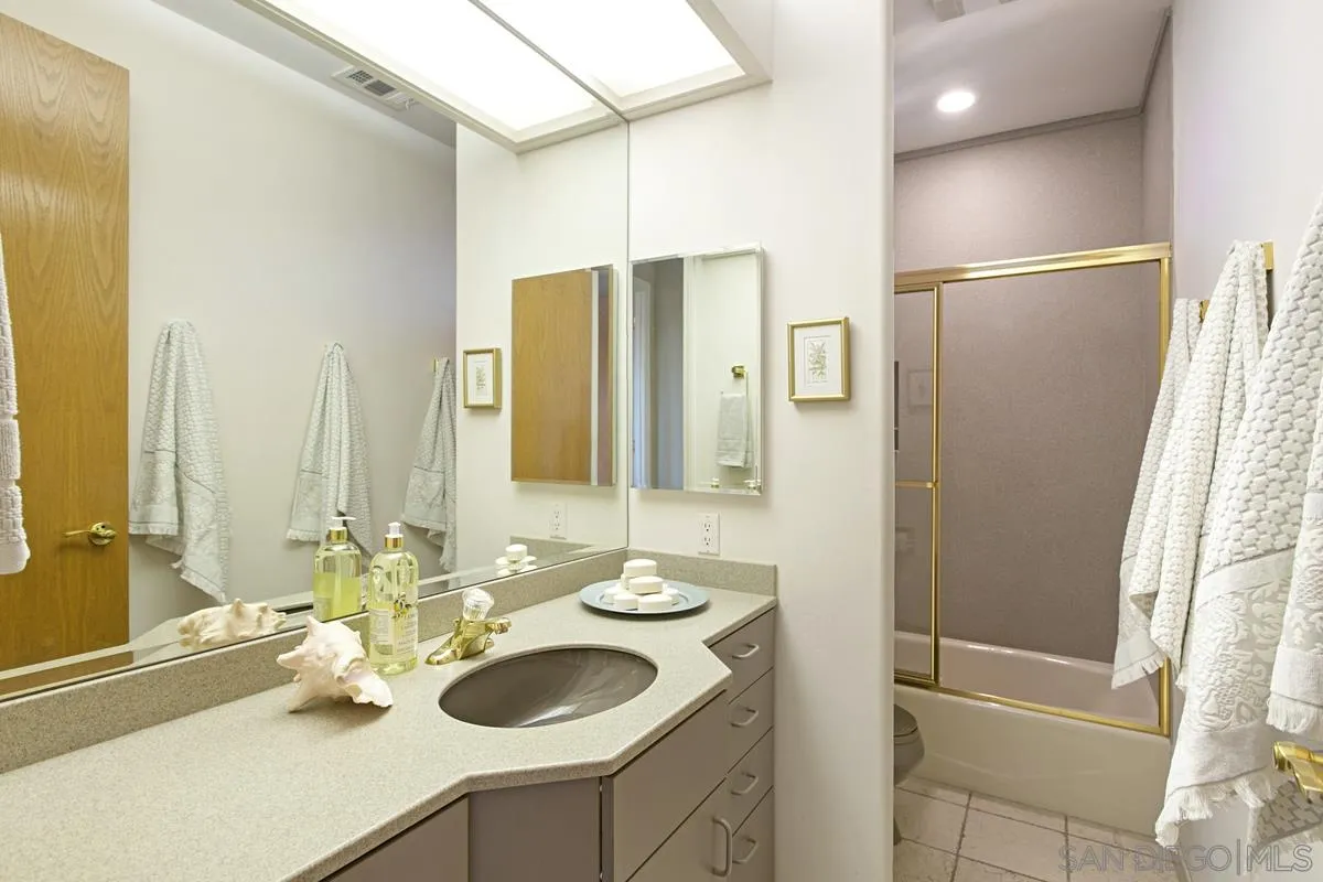 1629 Wild Acres Road Vista, CA 92084 - Photo 26 of 34 a bathroom with a sink and a mirror