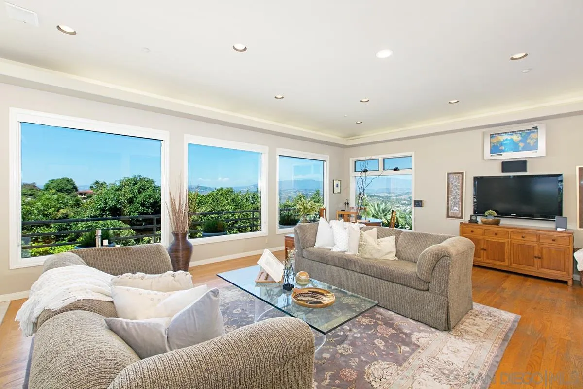 1629 Wild Acres Road Vista, CA 92084 - Photo 4 of 34 a living room with furniture and a flat screen tv