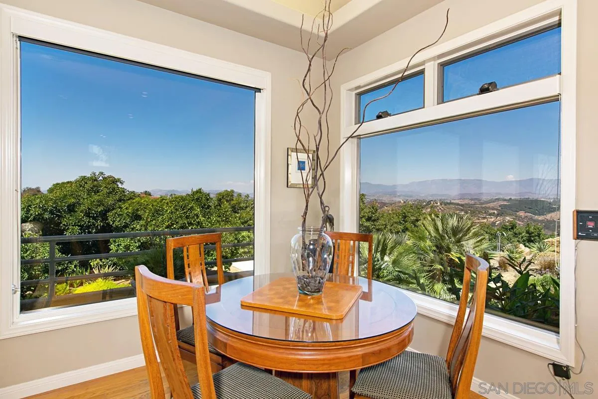 1629 Wild Acres Road Vista, CA 92084 - Photo 8 of 34 a view of a dining room with furniture window and wooden floor