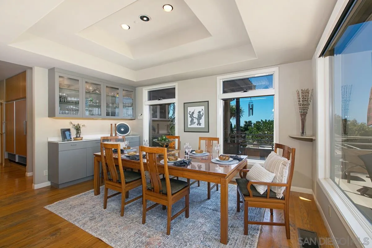 1629 Wild Acres Road Vista, CA 92084 - Photo 9 of 34 a view of a dining room with furniture window and wooden floor