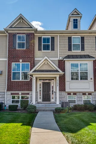 a front view of a house with a yard
