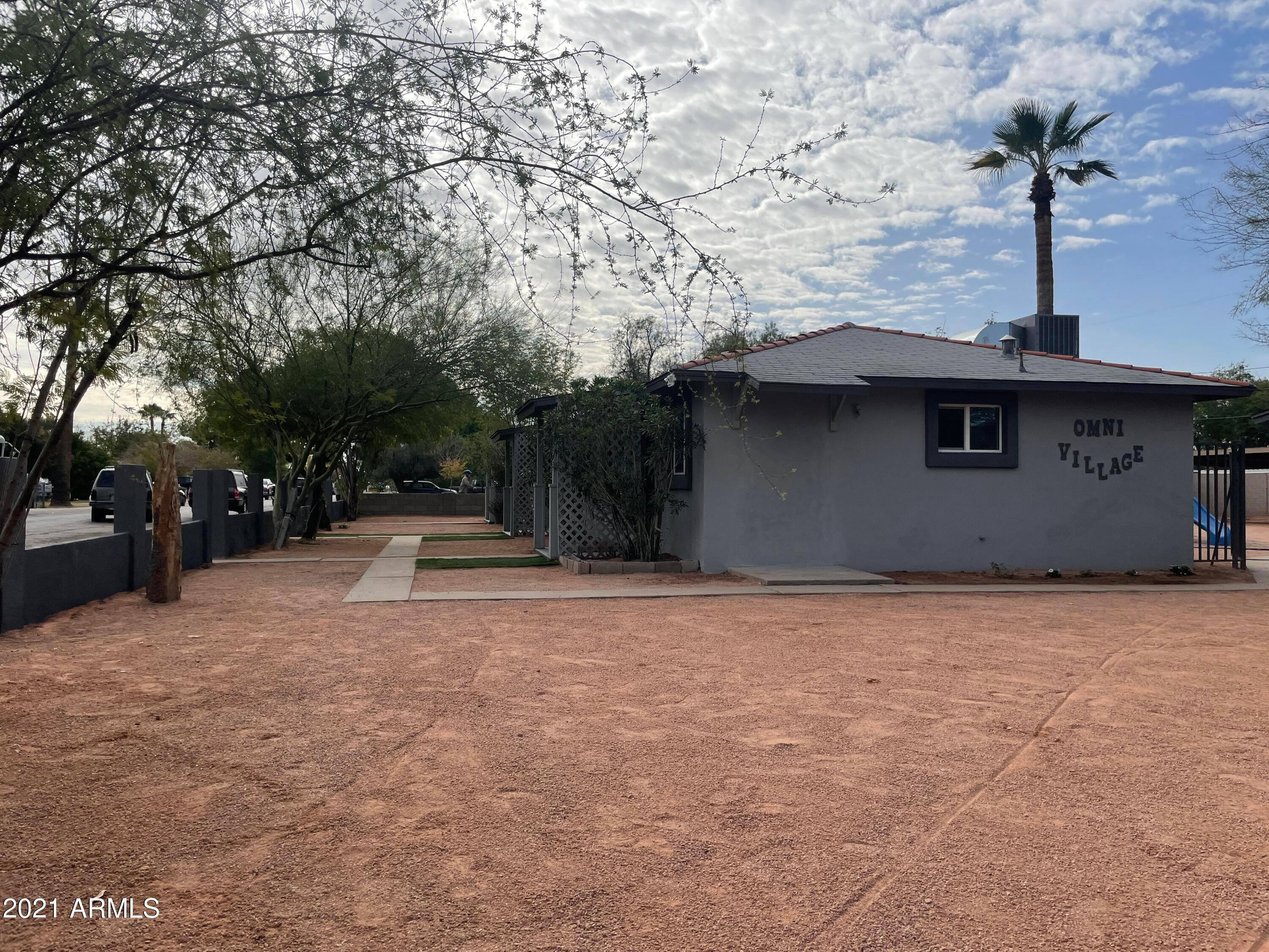 2242 North 29th Place, Unit 3 Phoenix, AZ 85008 - Photo 16 of 19 a backyard of a house with table and chairs