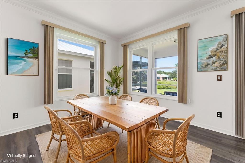 223 Stanhope Circle Naples, FL 34104 - Photo 39 of 41 Dining area featuring multiple double-hung windows with vertical blinds
