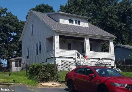 a front view of a house with parking space