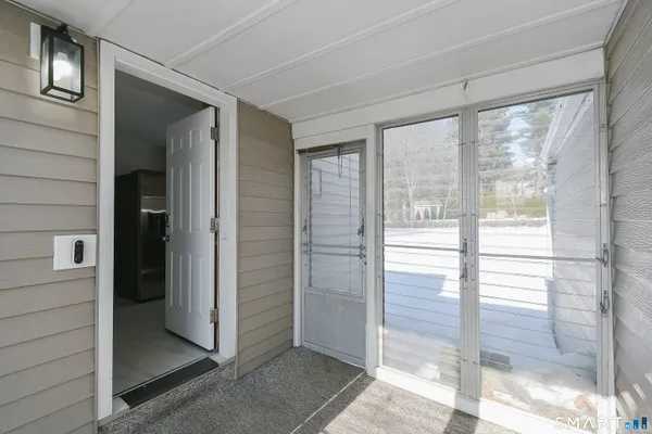 a view of a bathroom with a glass door