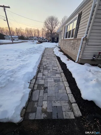a view of a backyard of the house