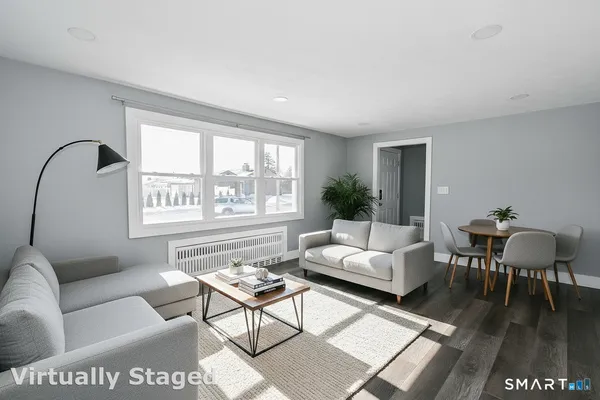 a living room with furniture and a window