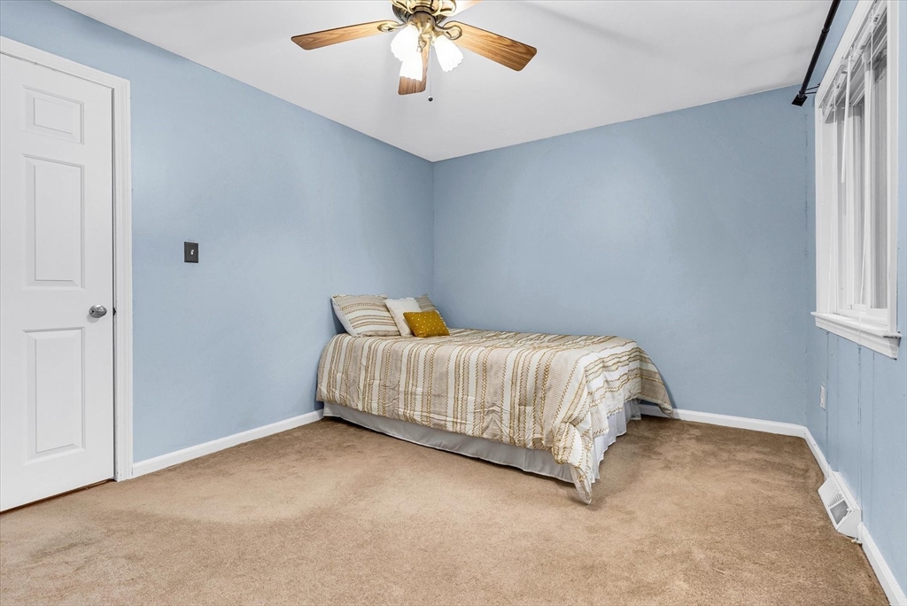 74 Meeting House Path, Unit 74 Ashland, MA 01721 - Photo 13 of 33 a bedroom with a bed and window