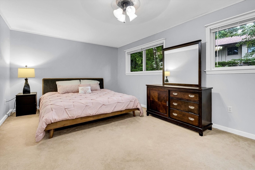 74 Meeting House Path, Unit 74 Ashland, MA 01721 - Photo 17 of 33 a bedroom with a bed and a dresser