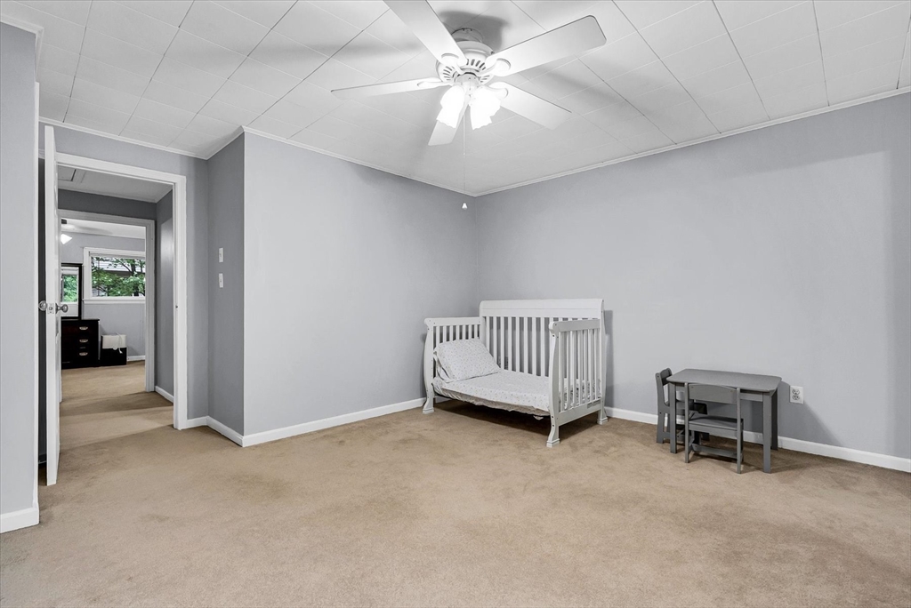 74 Meeting House Path, Unit 74 Ashland, MA 01721 - Photo 21 of 33 a view of a livingroom with a furniture and ceiling fan