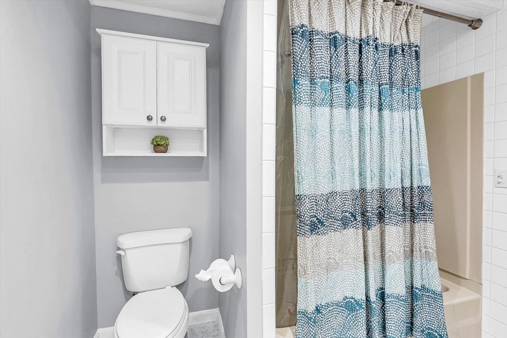 74 Meeting House Path, Unit 74 Ashland, MA 01721 - Photo 23 of 33 a bathroom with a toilet and shower