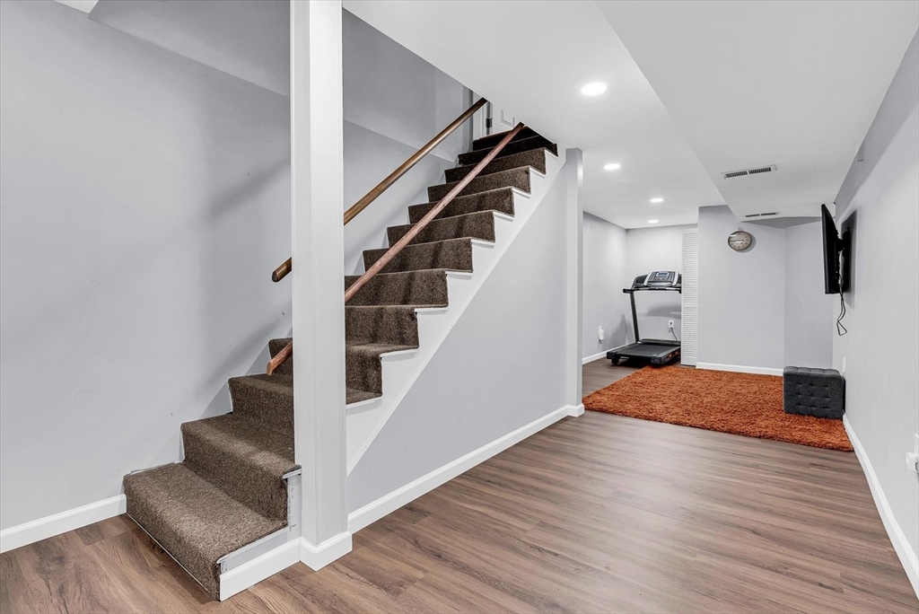 74 Meeting House Path, Unit 74 Ashland, MA 01721 - Photo 25 of 33 a view of entryway and hall with wooden floor