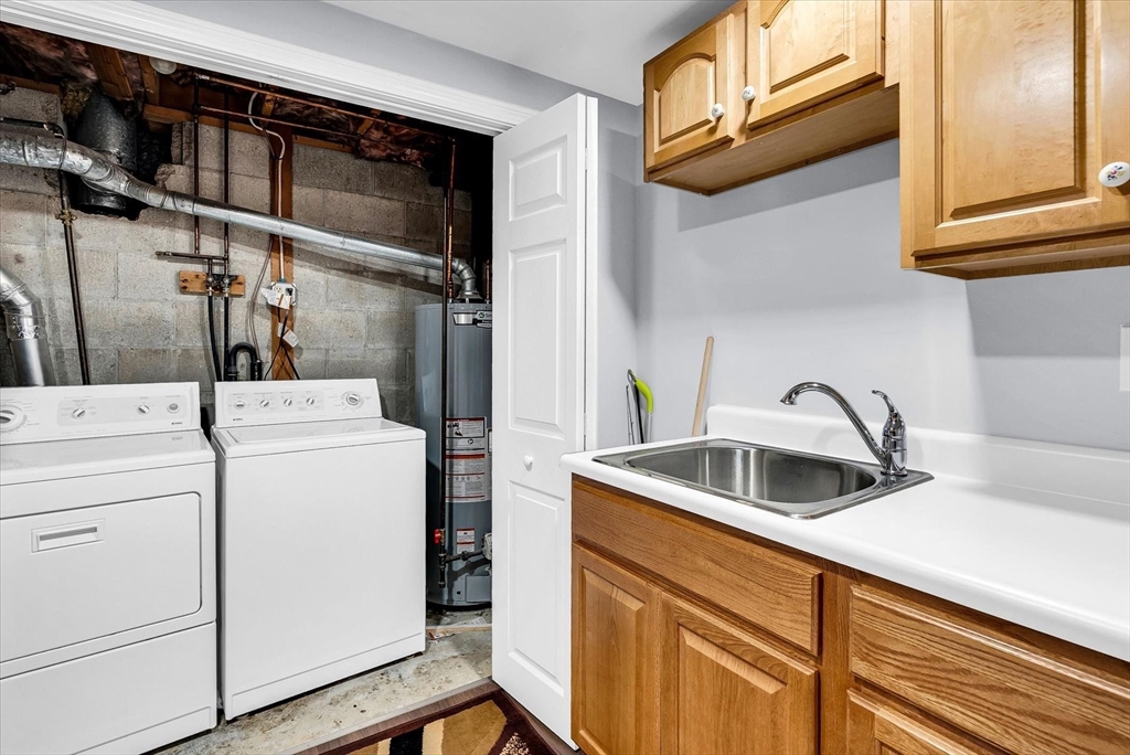 74 Meeting House Path, Unit 74 Ashland, MA 01721 - Photo 30 of 33 a kitchen with a sink and cabinets