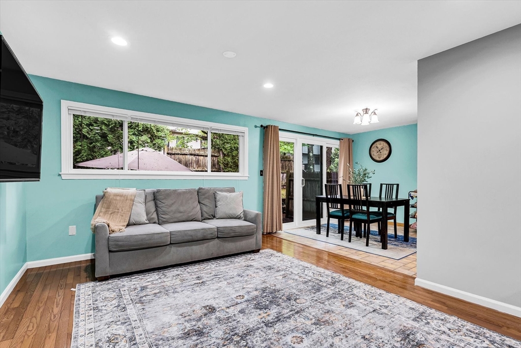 74 Meeting House Path, Unit 74 Ashland, MA 01721 - Photo 4 of 33 a living room with furniture and a large window