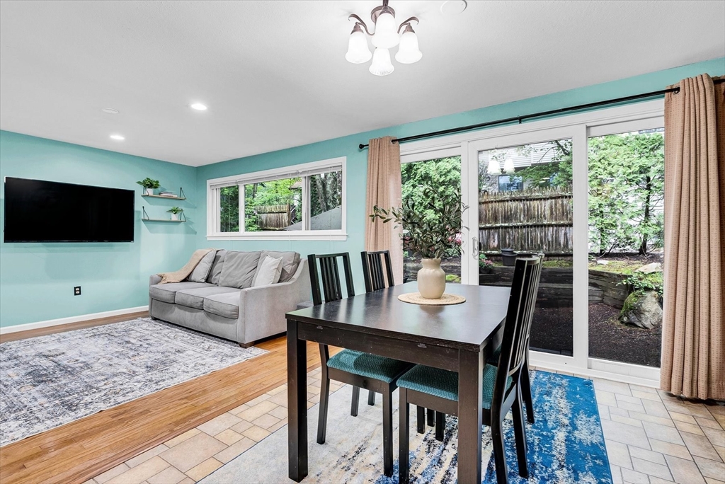 74 Meeting House Path, Unit 74 Ashland, MA 01721 - Photo 7 of 33 a living room with furniture and a flat screen tv