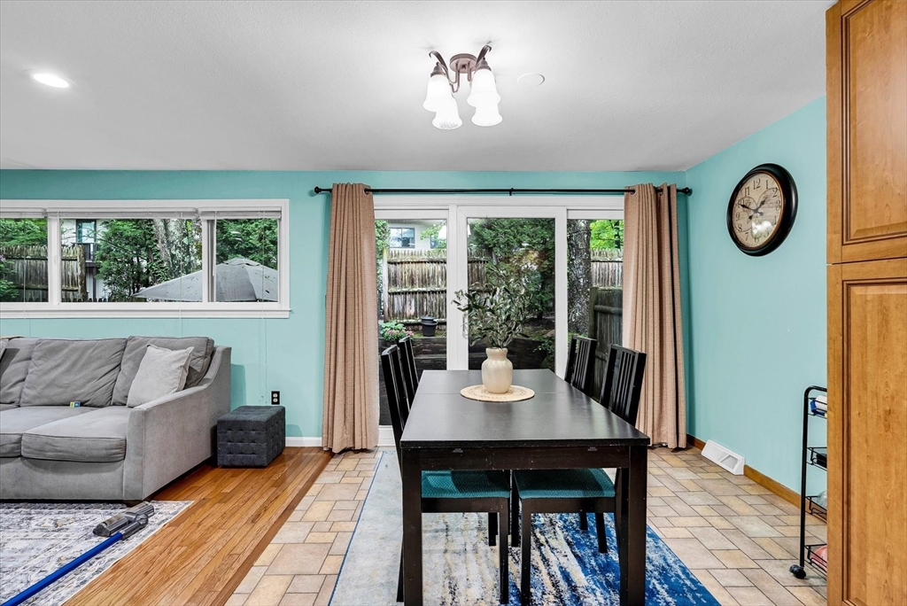 74 Meeting House Path, Unit 74 Ashland, MA 01721 - Photo 8 of 33 a living room with furniture and a large window