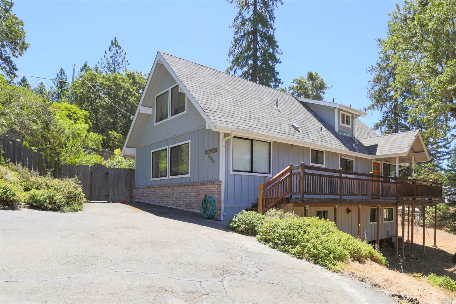 3611 Ridgewood Road Willits, CA 95490 - Photo 1 of 1 a front view of a house with a yard and trees
