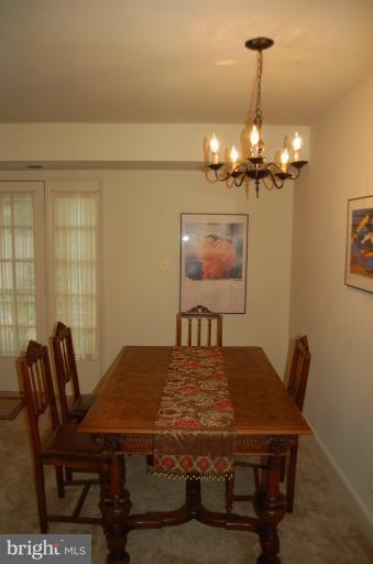8663 Geren Road, Unit 265 Silver Spring, MD 20901 - Photo 6 of 9 a view of a dining room with furniture