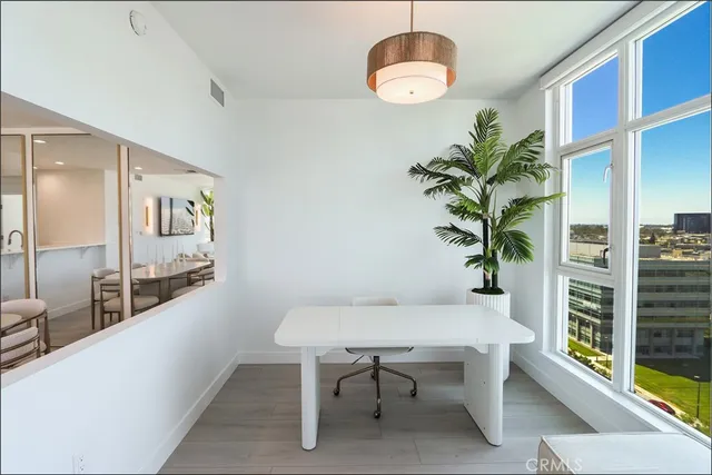 a view of a room with furniture and a potted plant