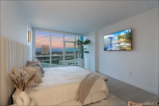 a bed sitting in a bedroom next to a window