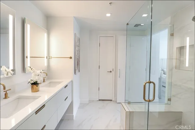 a bathroom with a double vanity sink mirror and double