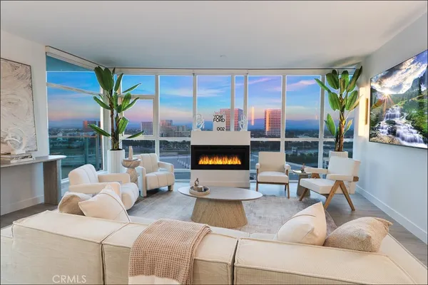 a living room with furniture large window and lamp
