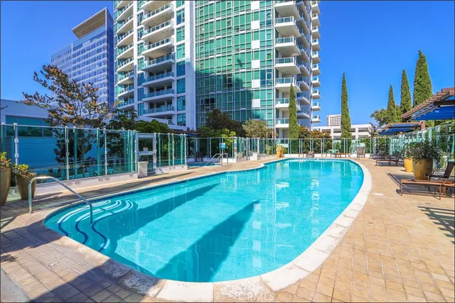 a view of a swimming pool with a lounge chairs