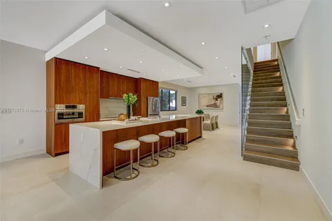 a room with lots of furniture and stairs