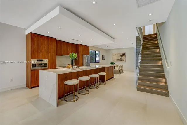 a room with lots of furniture and stairs