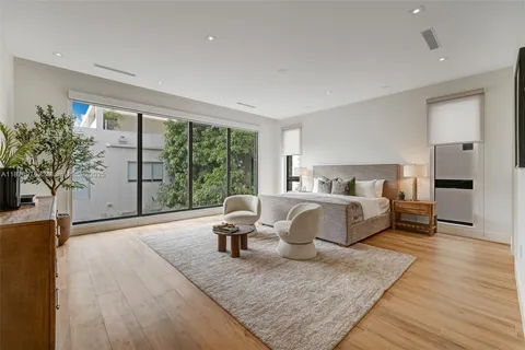 a bed room with a bed and a couch