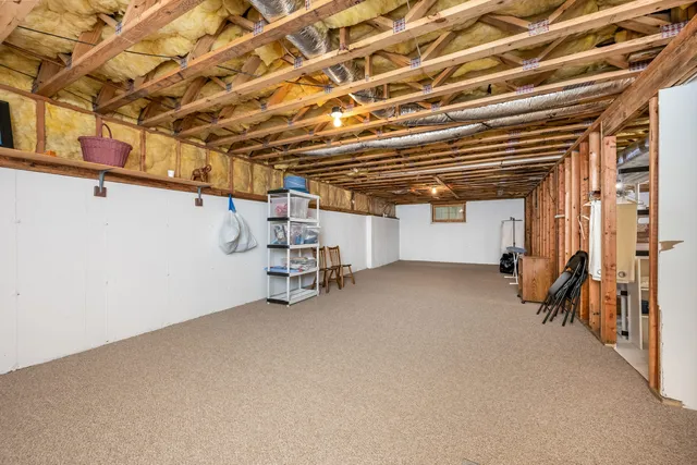 a view of empty room with wooden ceiling