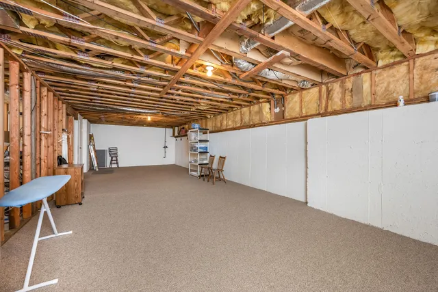 a view of a room with wooden walls