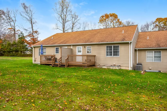 a view of a house with a backyard