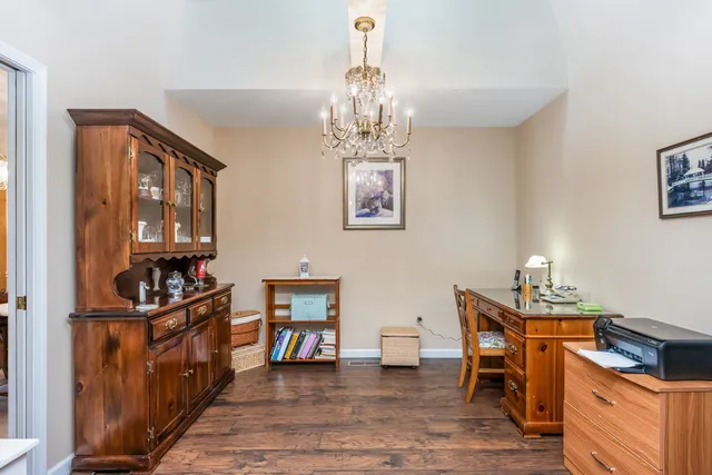 a kitchen that has a table and chairs in it
