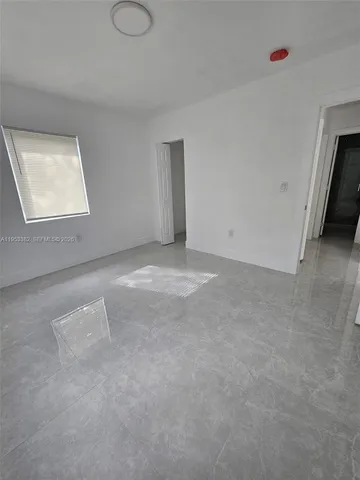 a bathroom with a shower toilet and sink