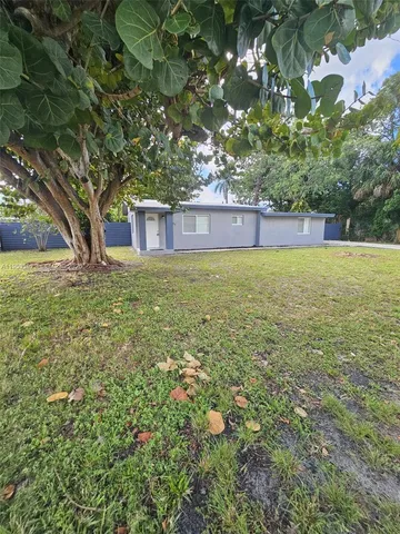 a view of a livingroom with furniture and an empty room