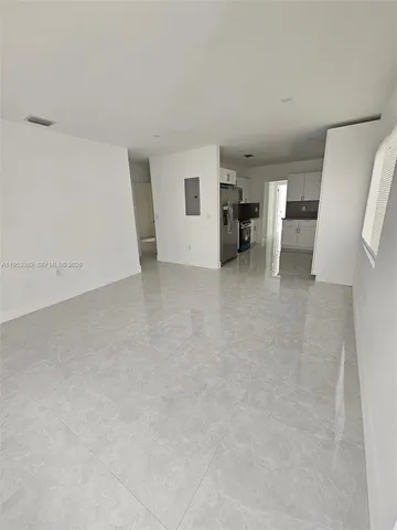 a view of an empty room with a window